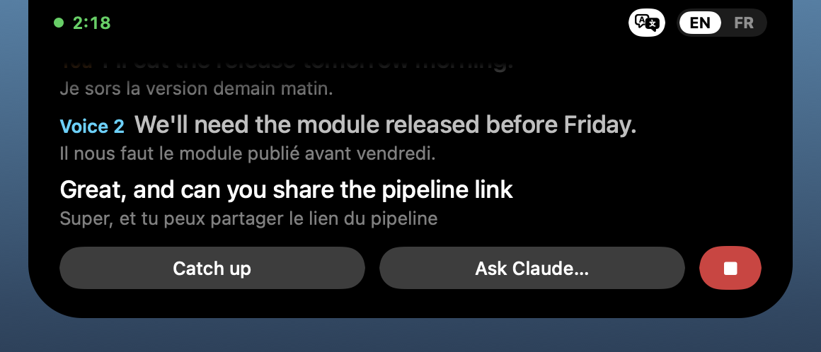 Live captions in the island: Voice 2’s line, its French translation underneath, Catch up, Ask Claude… and the red Stop button